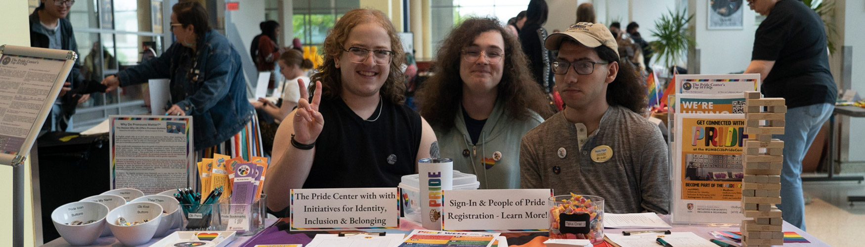 Students at Pride Center table at event